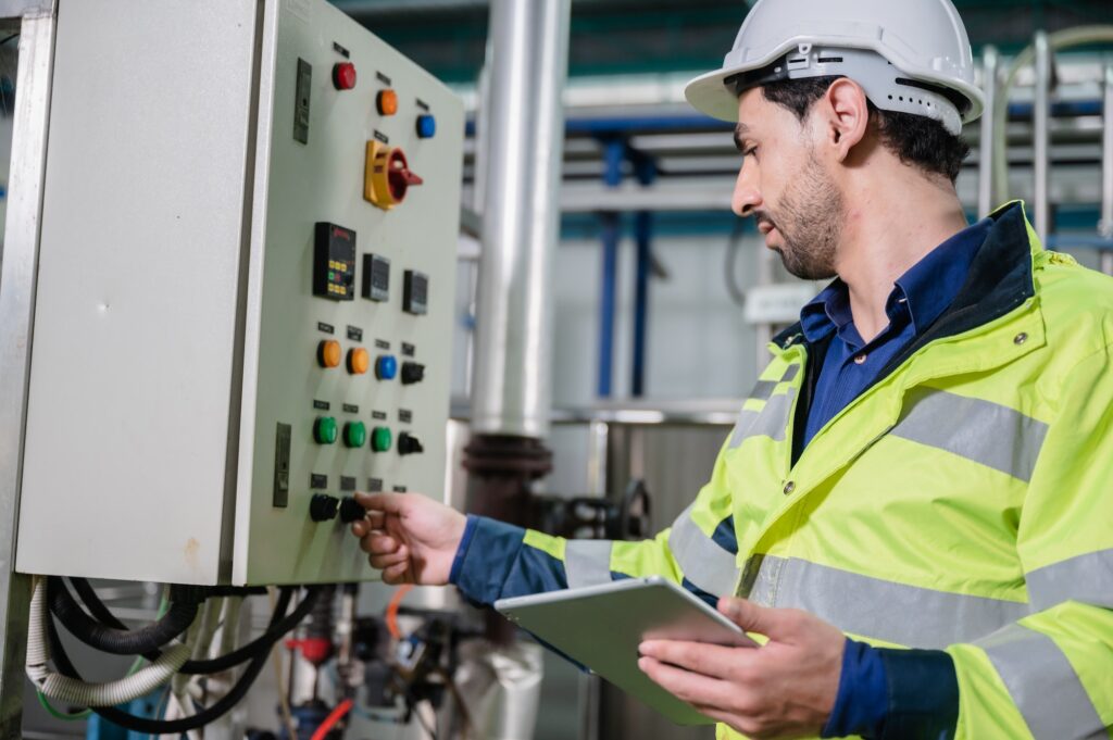 professional technician engineer working to control electrical power and safety service system